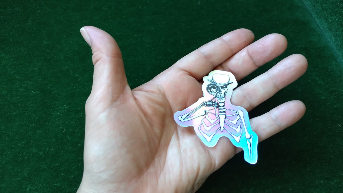 Inspector Skeli sticker in hand